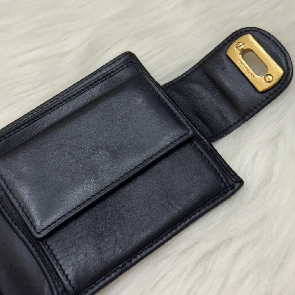 SALVATORE FERRAGAMO - BLACK LEATHER GOLD PLATED SECURE CLOSURE BIFOLD WALLET